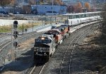 NS 9948 leads train O56 past train P080-28 in the station